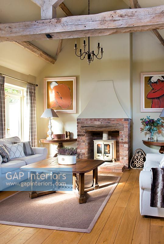 Living room with exposed beams and fireplace