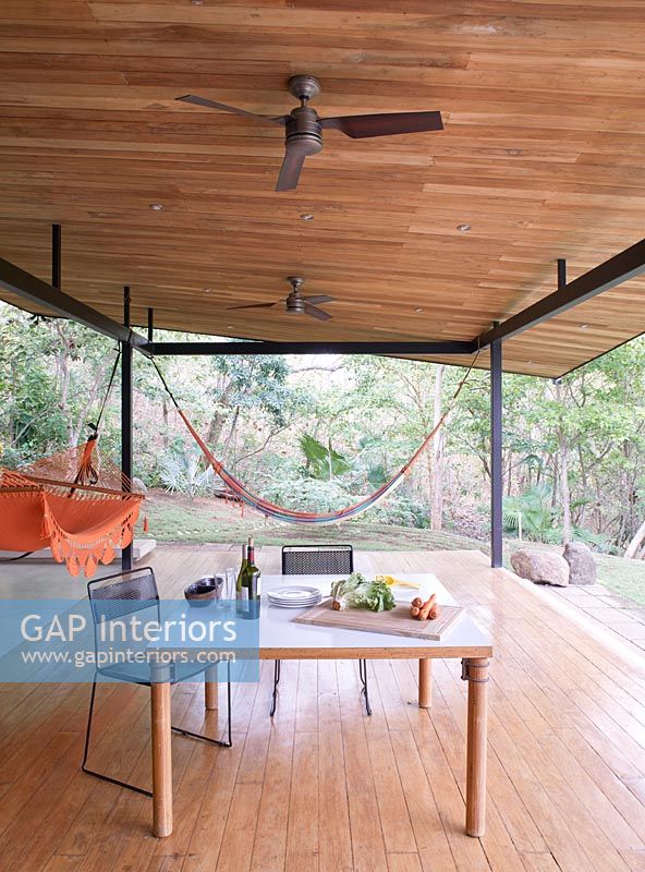 Covered patio area with hammocks