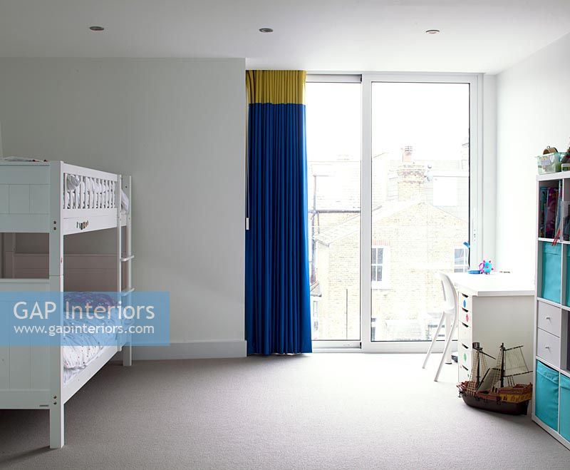 Childs bedroom with colourful curtains