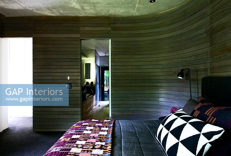 Modern bedroom with curved wall