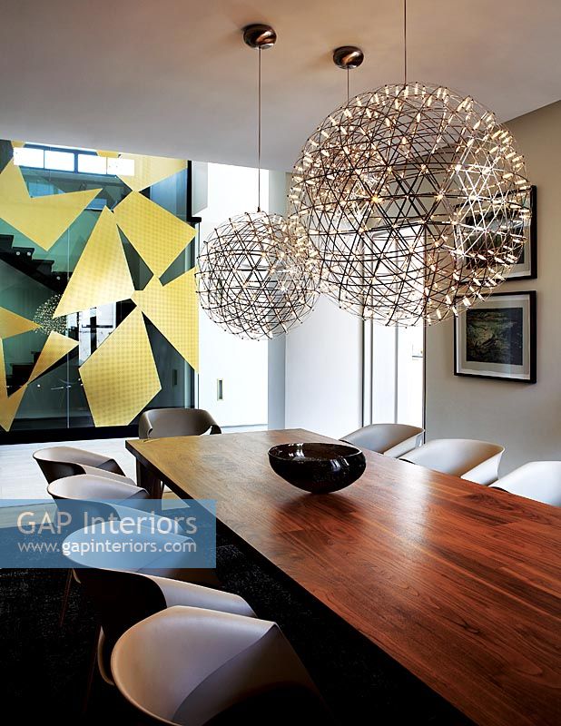 Spherical lights above dining table