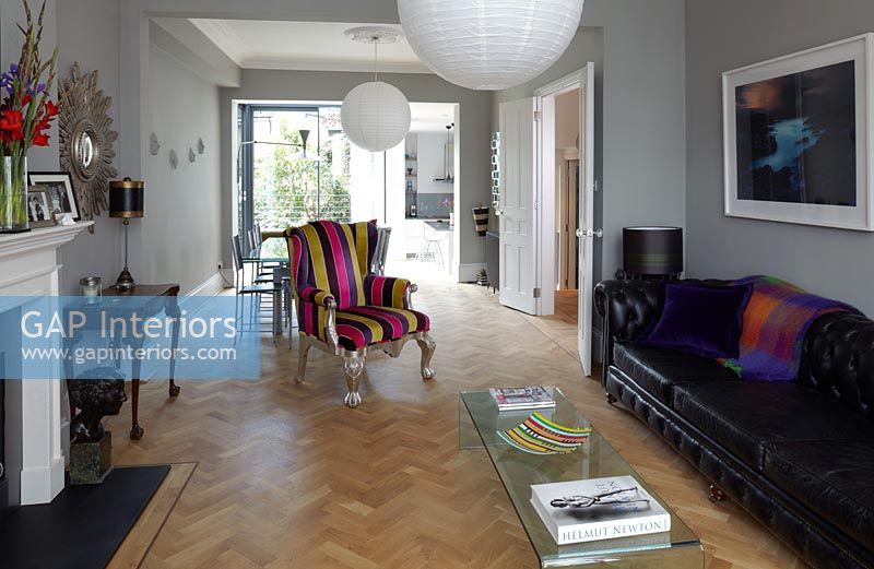 Open plan living space with parquet flooring
