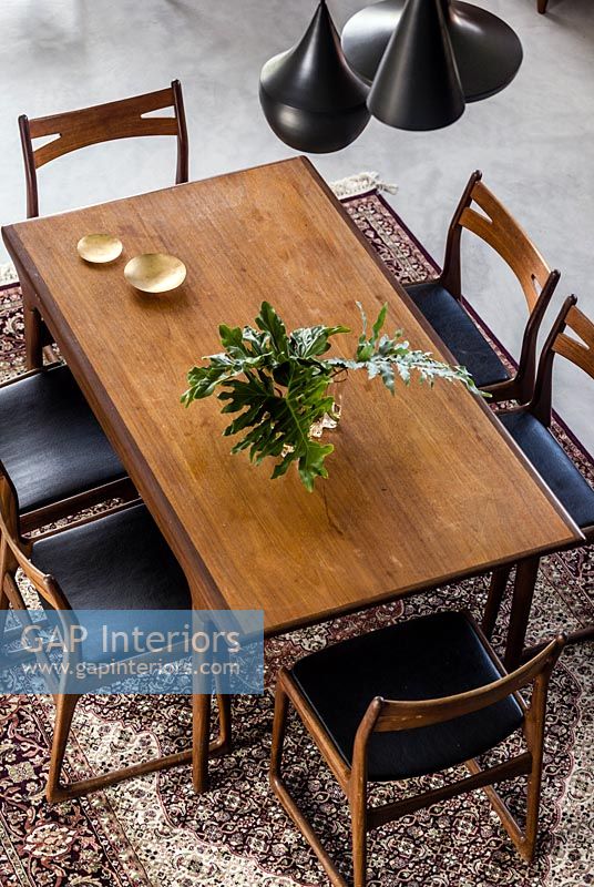 Open plan dining area with teak furniture