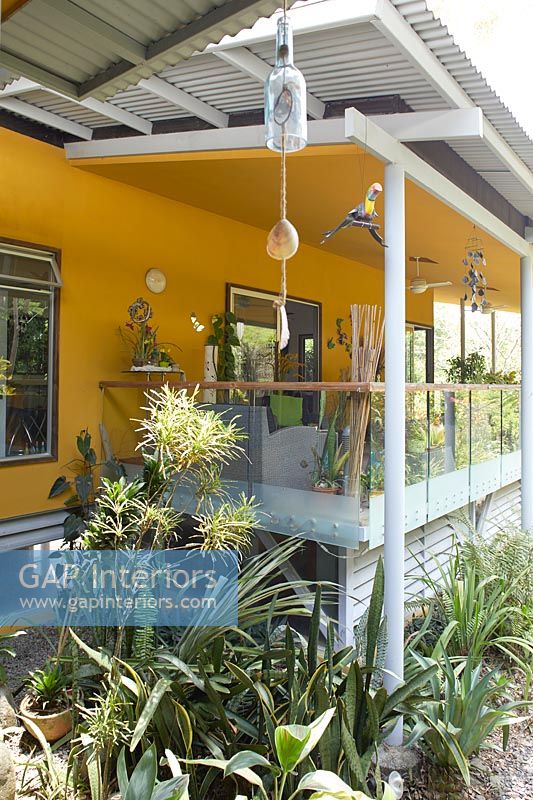 Colourful veranda and tropical planting