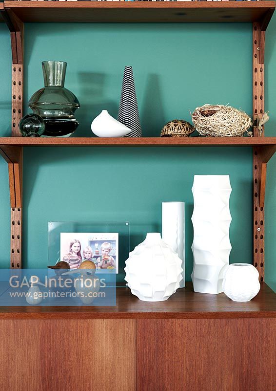 Accessories on wooden shelving unit