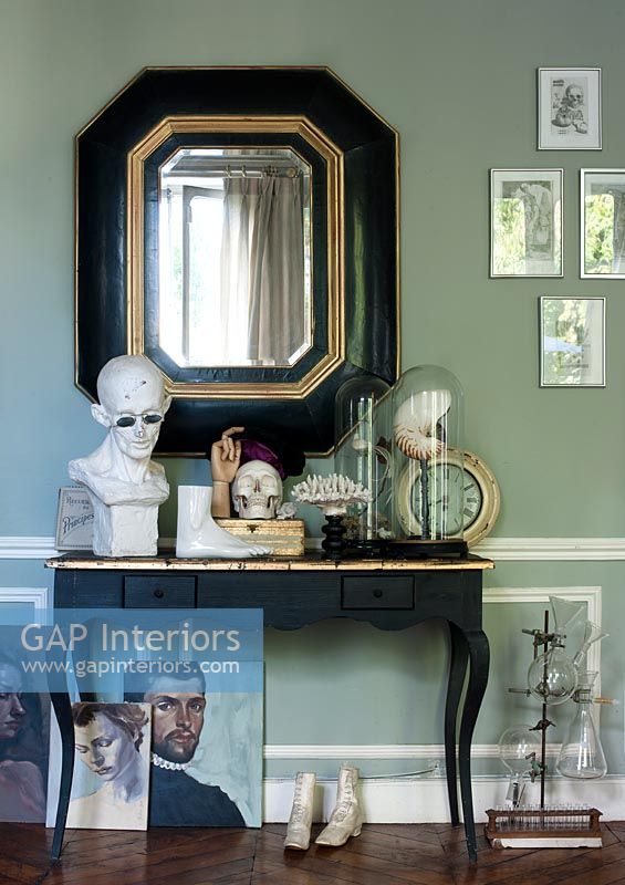 Accessories and collectibles on console table