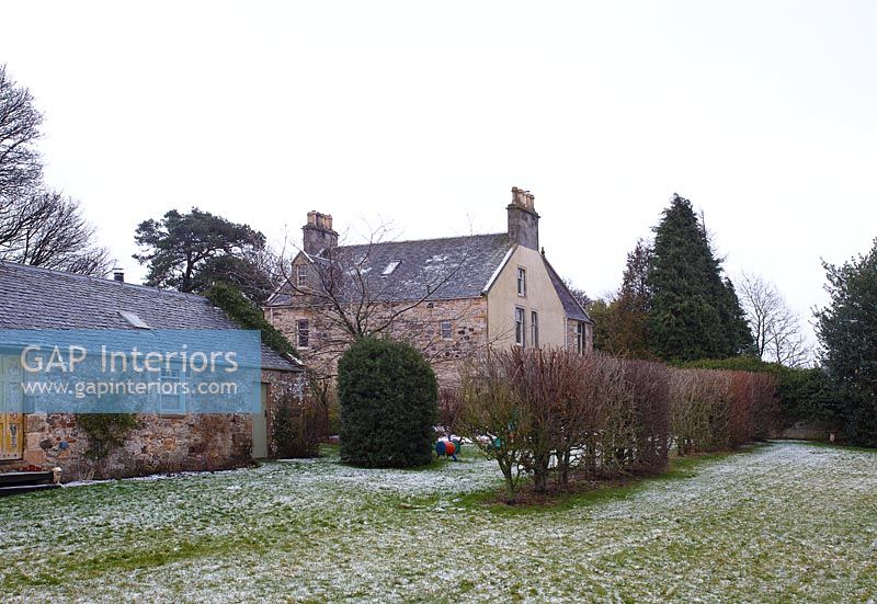 Country house and garden in winter