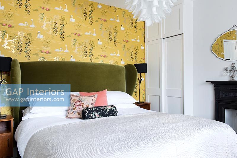 Bedroom with colourful wallpaper