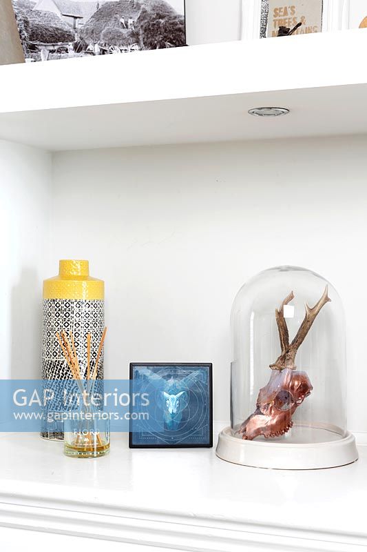 Accessories on white shelves
