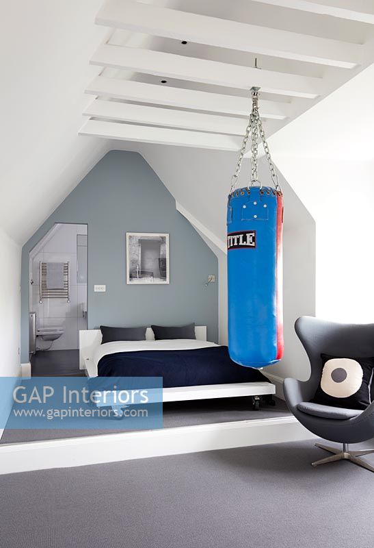 Modern bedroom with sports equipment