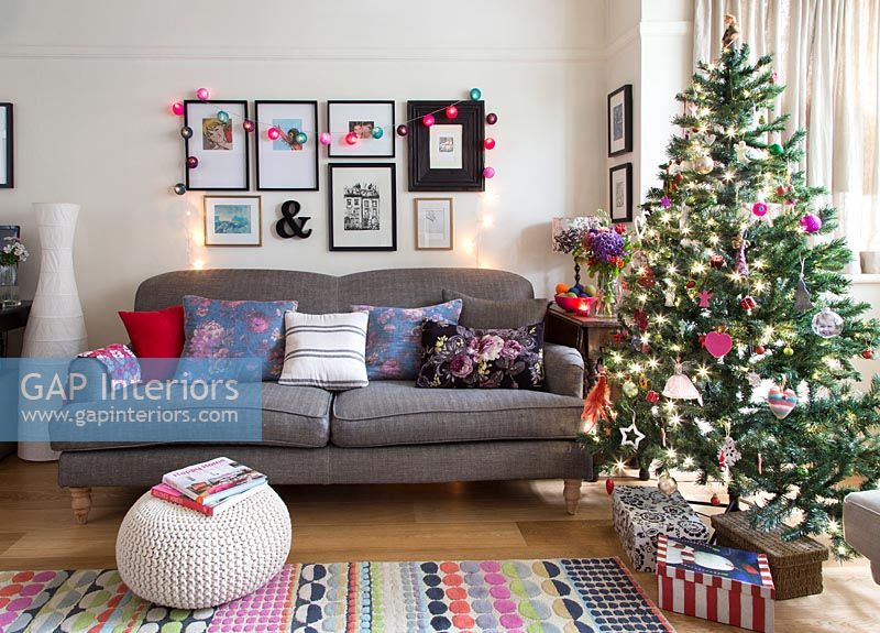 Christmas tree beside sofa