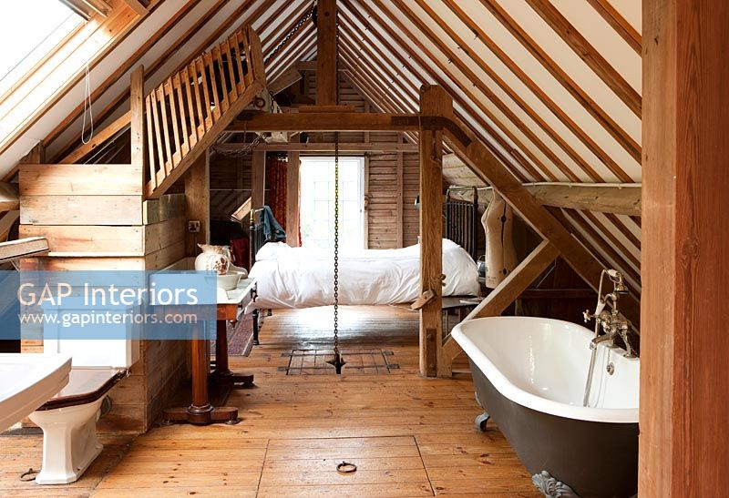 Bedroom and ensuite bathroom in converted mill