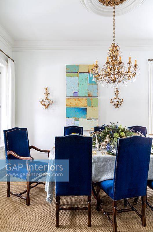 Blue chairs at dining table