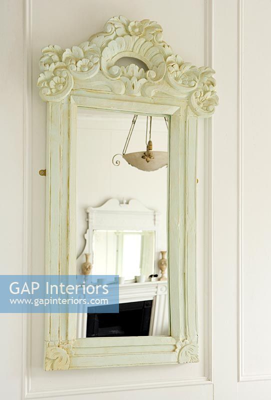Mirror with ornate frame