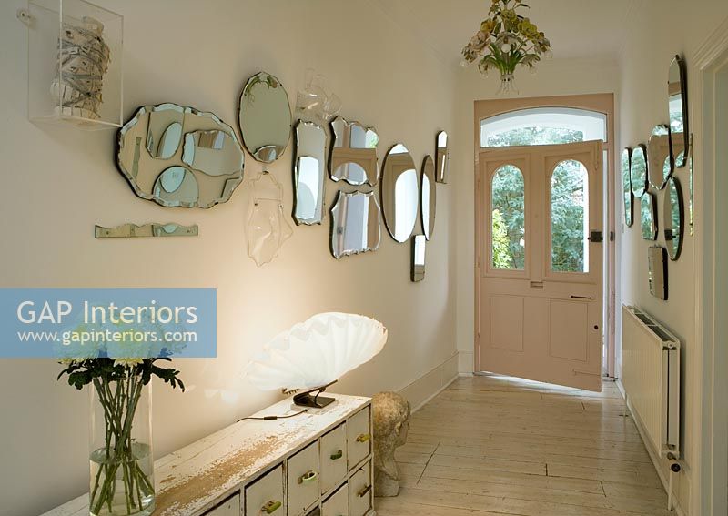 Hallway with mirror collection