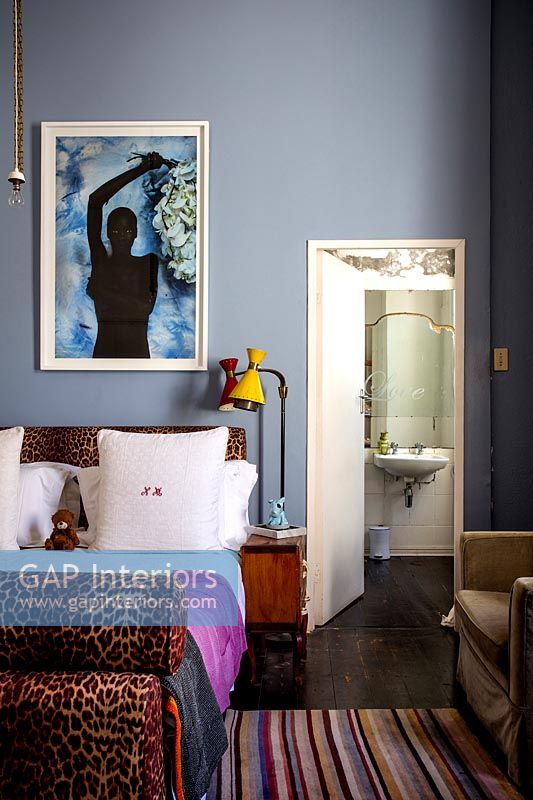 Colourful bedroom with ensuite bathroom