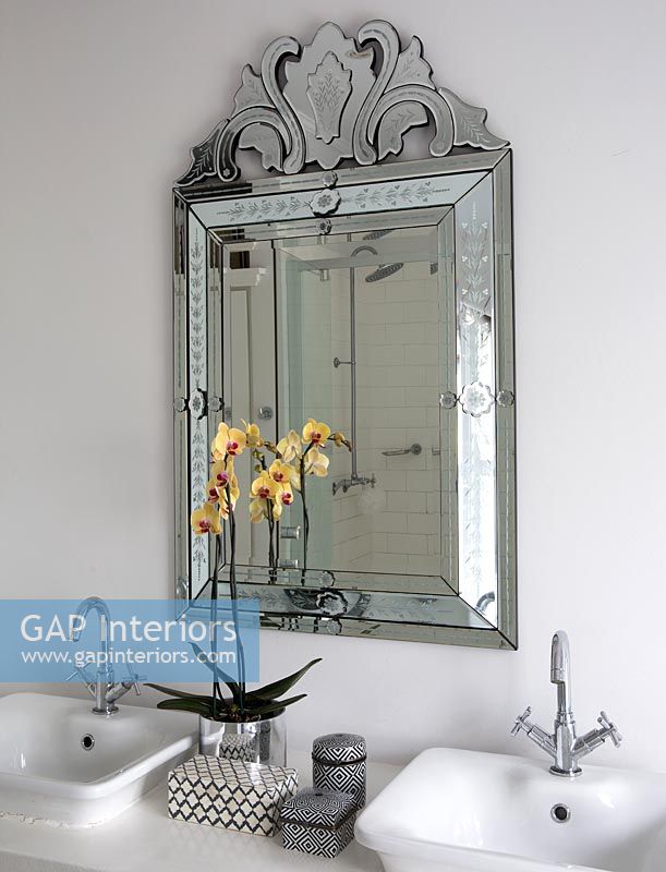 Venetian style mirror in bathroom
