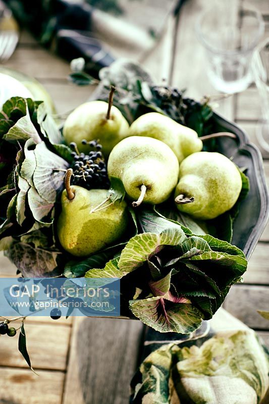 Pears and vegetables in metal bowl