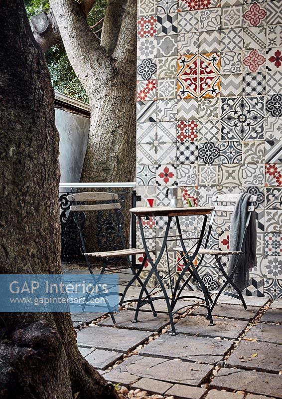 Patio with tiled wall