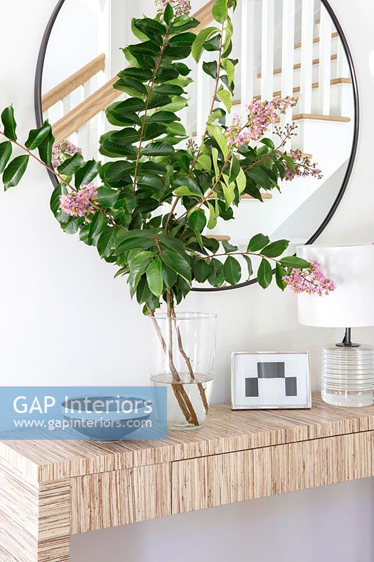 Vase of flowers on console table