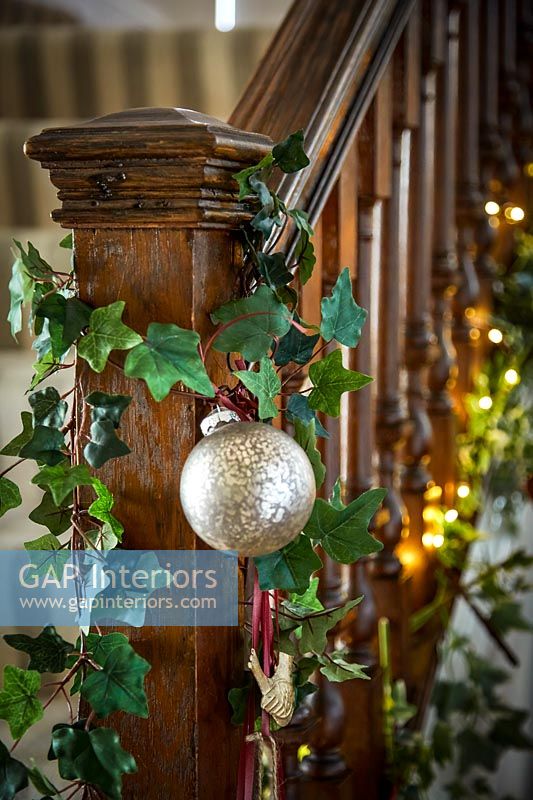 Christmas bauble hanging from bannisters