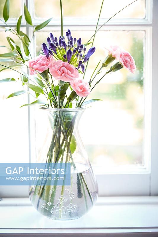 Vase of Dianthus and Agapanthus flowers