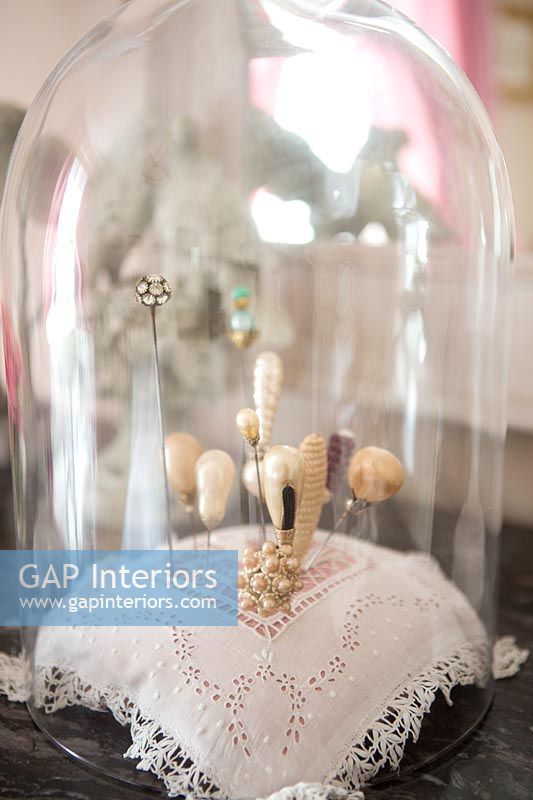Pins in a glass dome