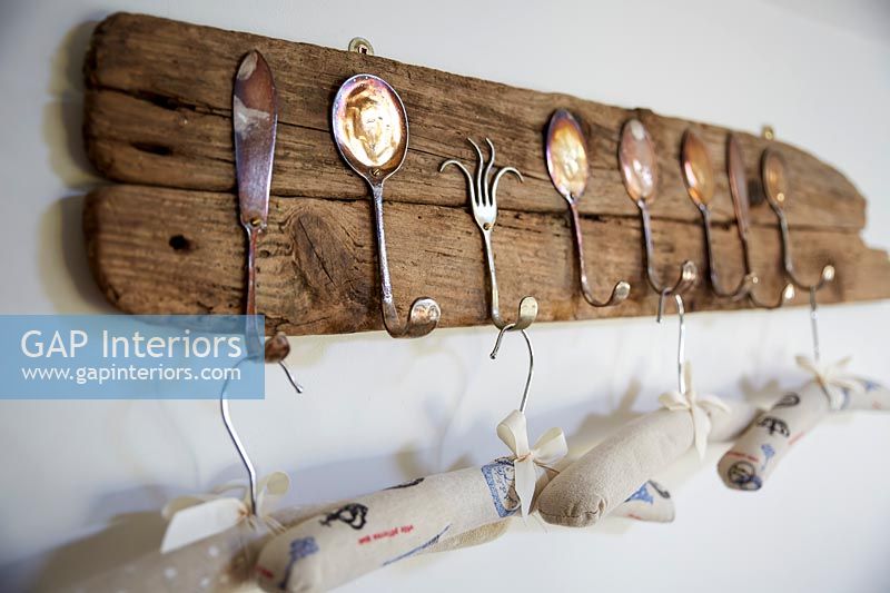 Wooden hook rack made from old cutlery