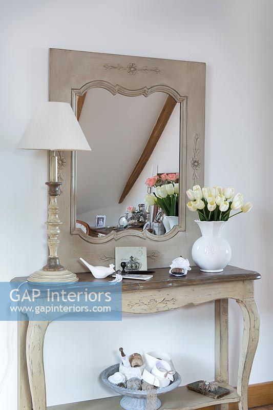 Mirror on sideboard with ornaments