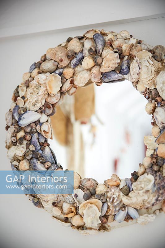 Mirror with seashell frame