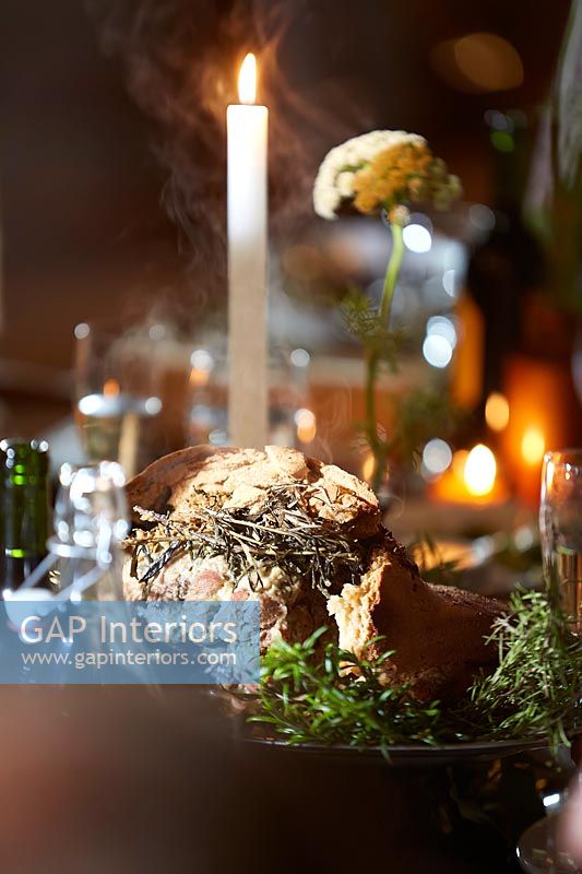 Detail of salt dough wrapped lamb at the decorated dining table 