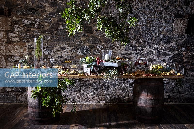 Food displayed on a rustic wooden serving table 