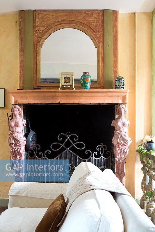 Detail of classic fireplace with metal guard