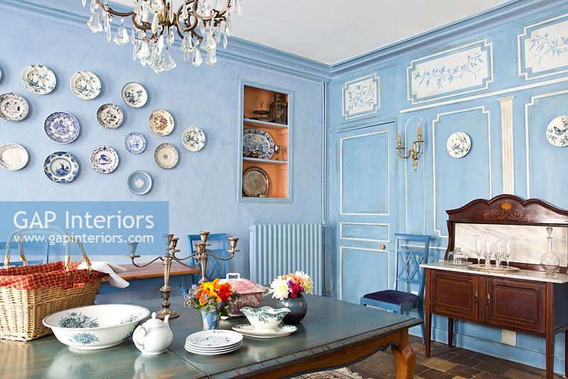 Classic dining room with wall display of plates