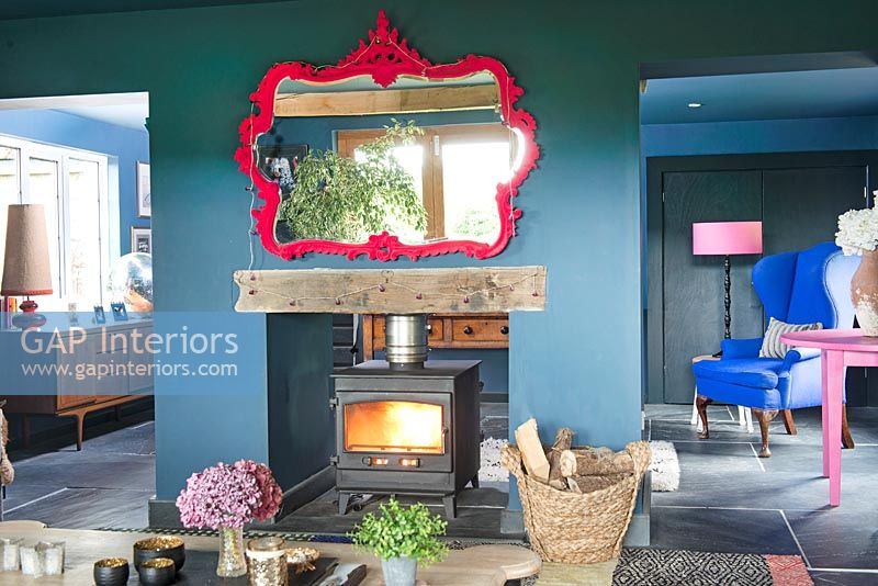 Wood burning stove in colourful modern living room