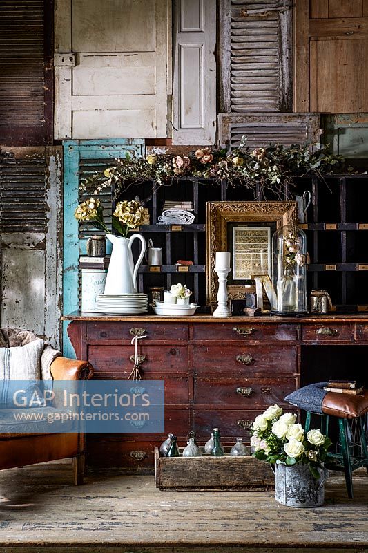 Decorated vintage wooden sideboard