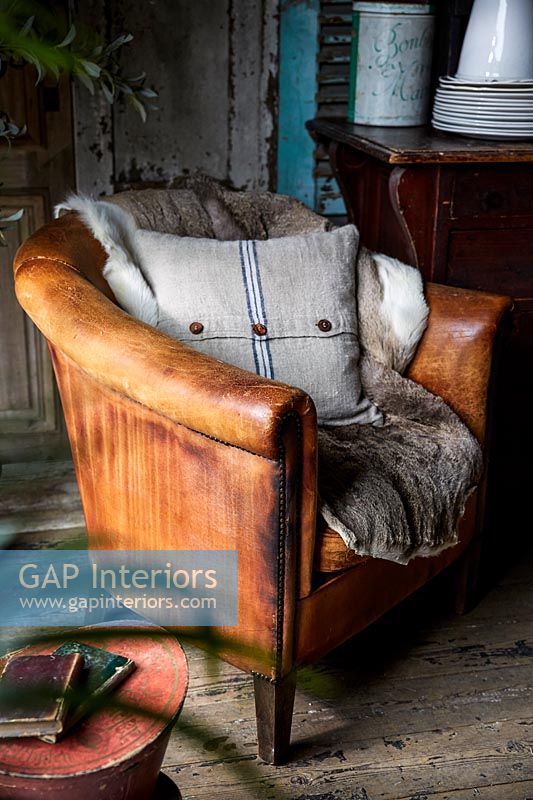 Detail of vintage leather armchair