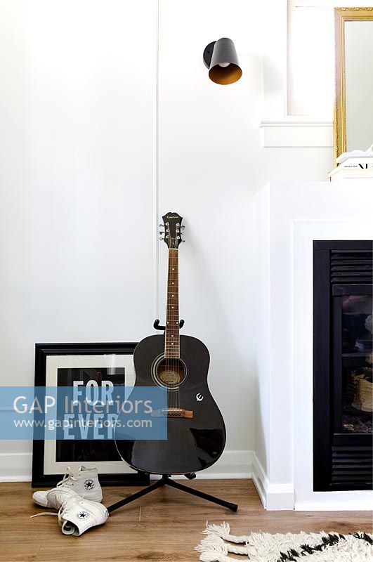 Detail of guitar in modern living room