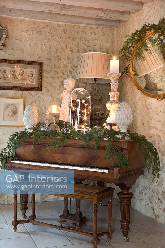 Classic wooden piano decorated for Christmas