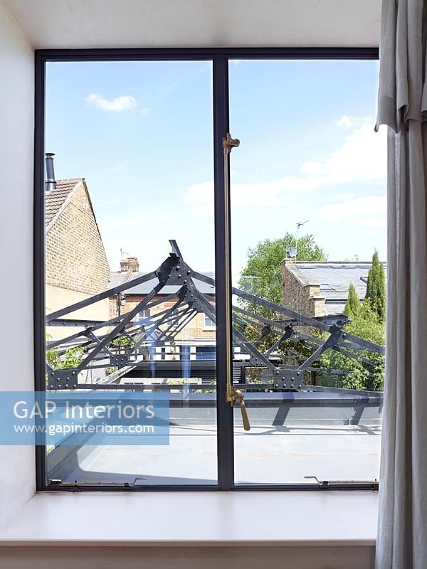 Bedroom window with view to metal courtyard roof