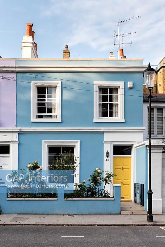 Exterior of colourful painted house in Portobello Road, London, UK
