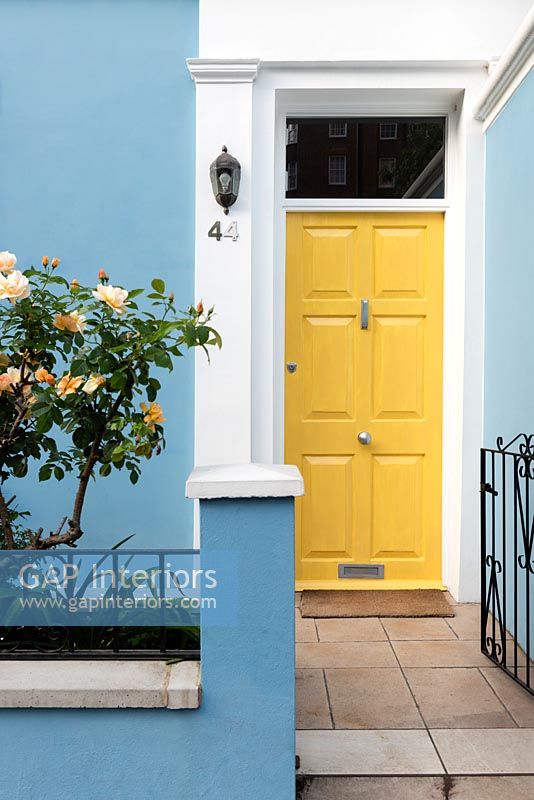 Colourful painted front door of house, London, UK