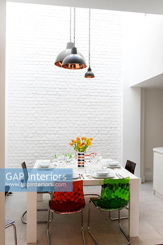 Dining area with 3D faux brick wallpaper 