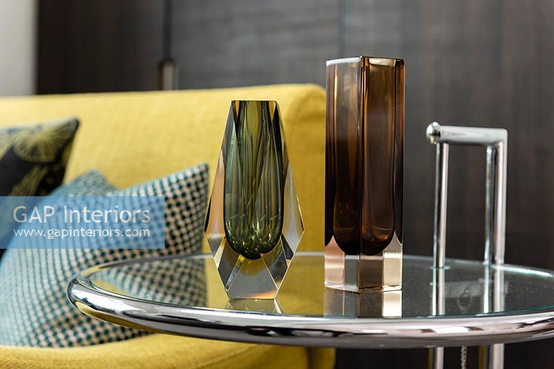 Detail of glass vases on side table