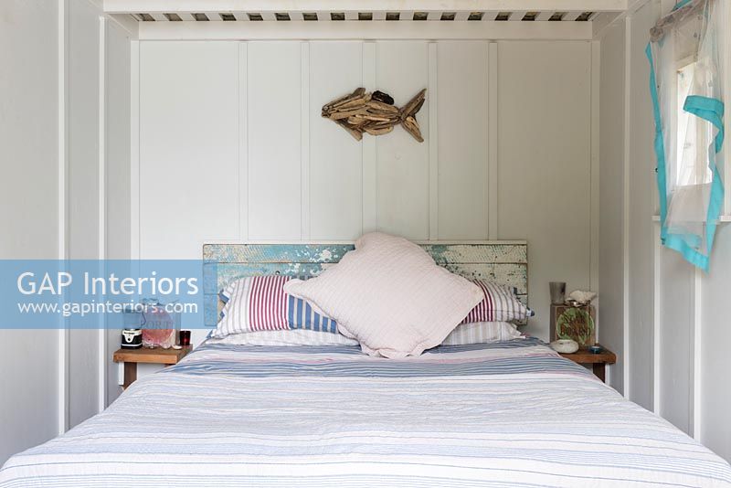 Detail of fish artwork on bedroom wall