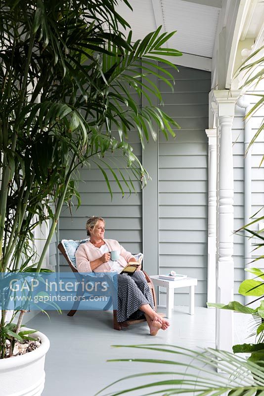 Vanessa Owen, owner sitting on the veranda