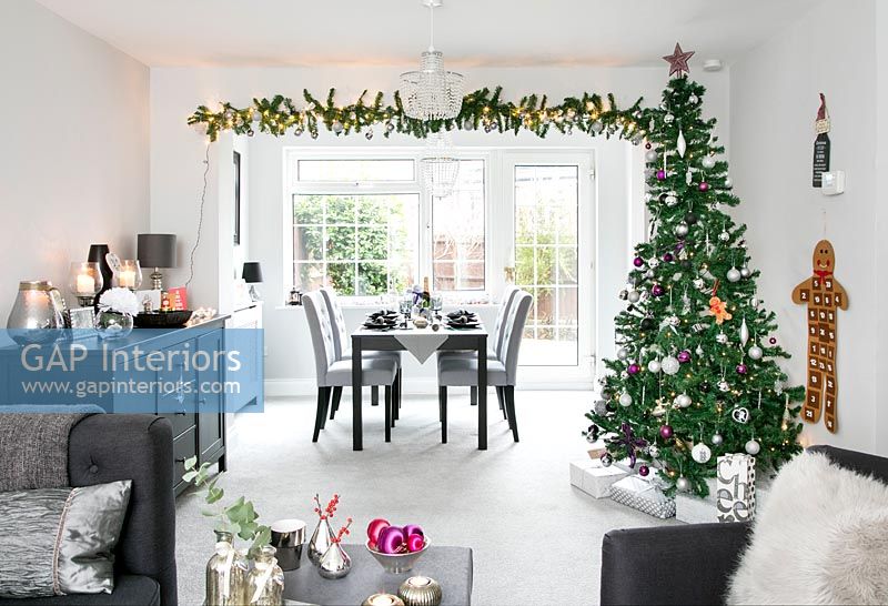 Modern open plan living area decorated for Christmas 