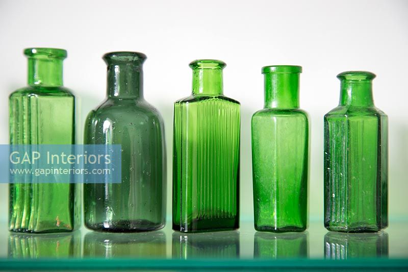 Display of glass bottles on shelf