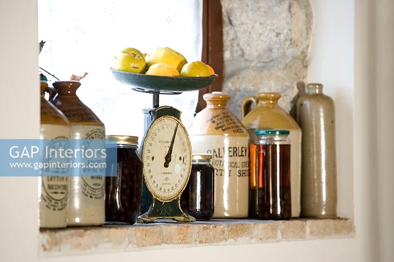 Detail of windowsill with vintage bottles