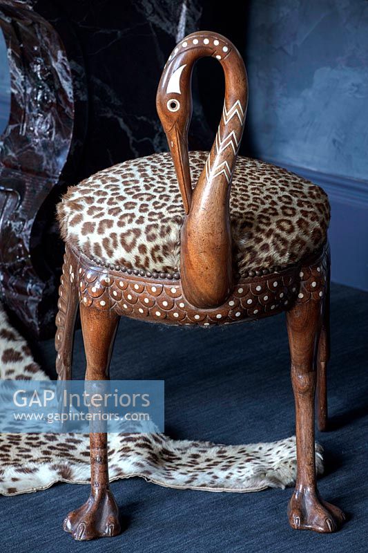 Detail of carved wooden bird chair